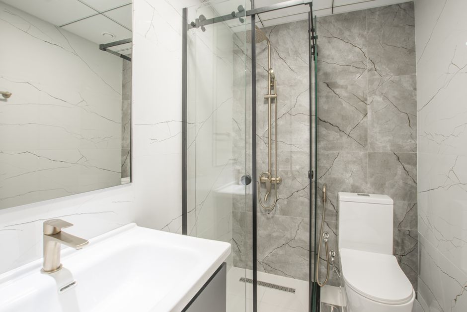 Side-by-side bathroom showing concealed vs exposed cistern toilet options in a UK bathroom refit